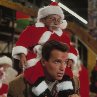 Still of Arnold Schwarzenegger and Verne Troyer in Jingle All the Way