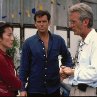 Pierce Brosnan, Michelle Yeoh and Roger Spottiswoode in Tomorrow Never Dies