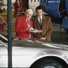 Still of Pierce Brosnan and Desmond Llewelyn in Tomorrow Never Dies