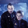 Still of Gary Oldman and Jack Johnson in Lost in Space