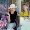 Director Dennie Gordon (left) and star David Spade discuss a scene