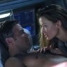 Chris Kelvin (George Clooney) and Rheya (Natascha McElhone) share a passionate moment amid the turmoil surrounding her shocking appearance aboard a space station.