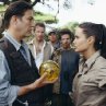 (Front left to right) CiarÃ¡n Hinds as Jonathan Reiss and Angelina Jolie as Lara Croft (back left) Christopher Barrie as Hillary and (back right) Noah Taylor as Bryce.