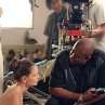 Katie Holmes and director Forest Whitaker discuss a scene on the set of FIRST DAUGHTER.