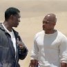 Lost in a desert wasteland, AJ (Tyrese Gibson, left) and Jeremy (Kirk Jones) plan their next move.