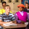 Rudy (Shedrack Anderson III, right) makes a new friend with his classmate (Aaron Carter) at school.